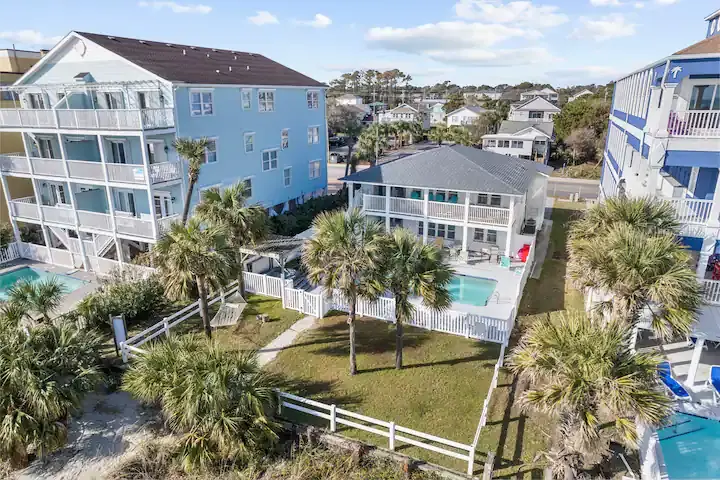 Aerial view of beachfront vacation homes along the shoreline